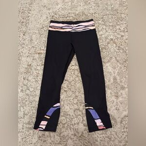 Lulu lemon black leggings with fun minimal design on band and bottom